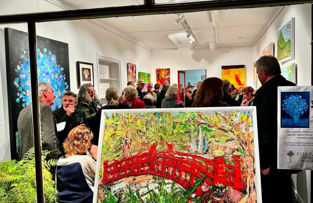 People gathered at the Clear Space gallery for an art exhibition opening.